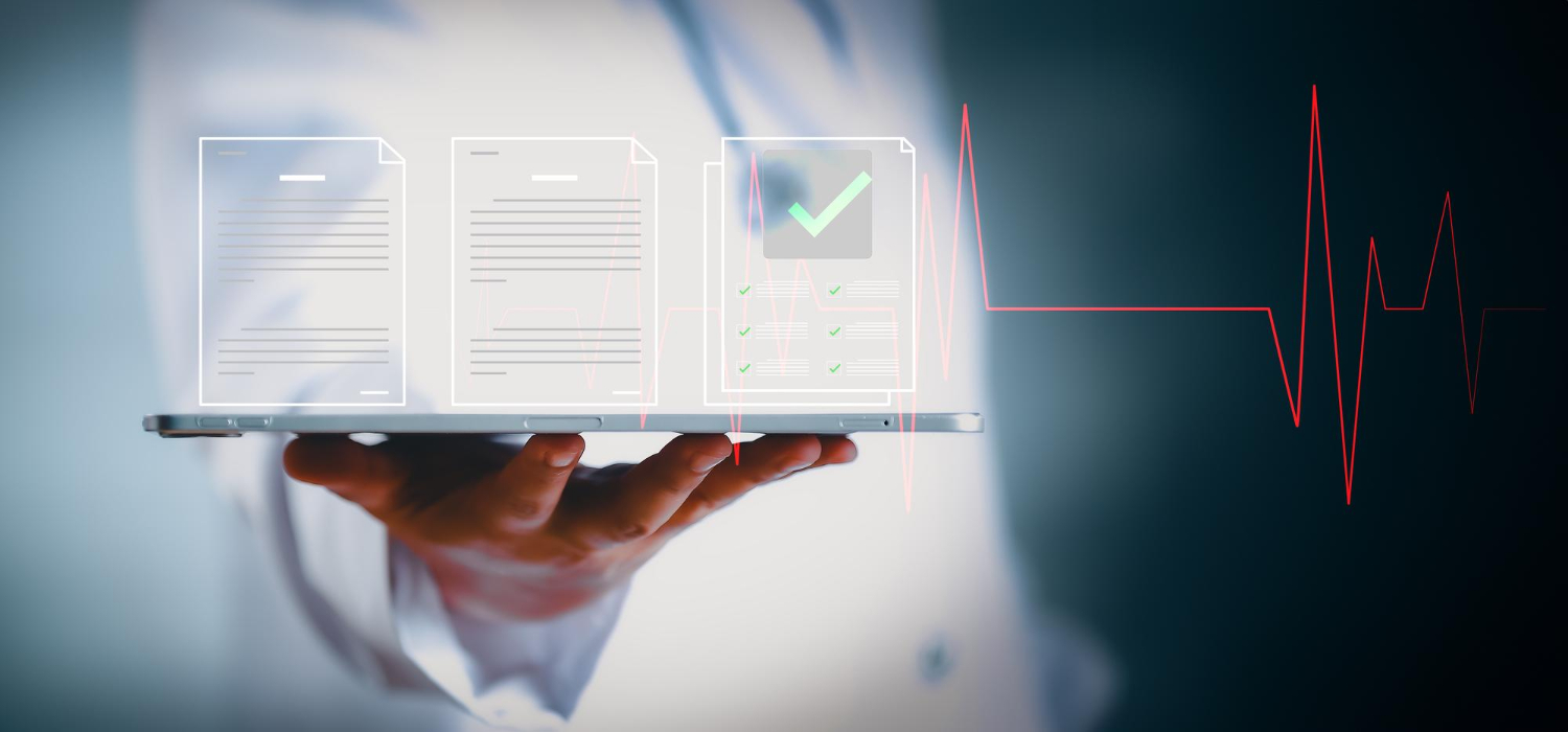 A person holds a tablet displaying EHR digital documents with a heartbeat line in the background.